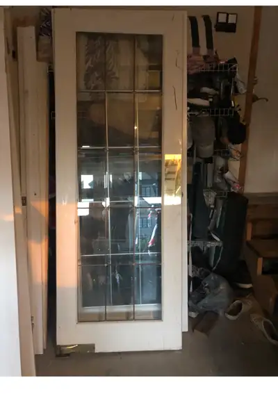 Swing /push solid wood French door with bevel etching glass 30”x80” in good condition asking $85