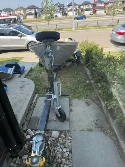 This is a used 12ft aluminum boat and trailer, ready for your next water adventure! The boat is stur...