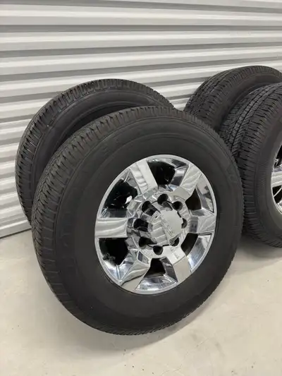 Factory 8 Bolt GMC 2500 SLT wheels and tires Rims are in great condition Tires are Goodyear wrangler...