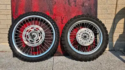 A complete set of DR650 wheels from a 2022 model. Front: Wheel Brake rotor Brake pads used with the...