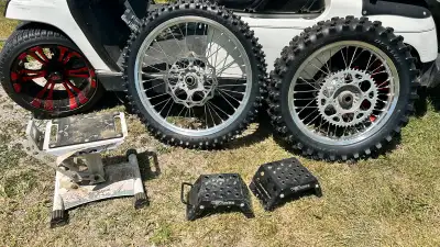Set up for sand , factory rims with aftermarket sand tire front and rear ready to install with rotor...