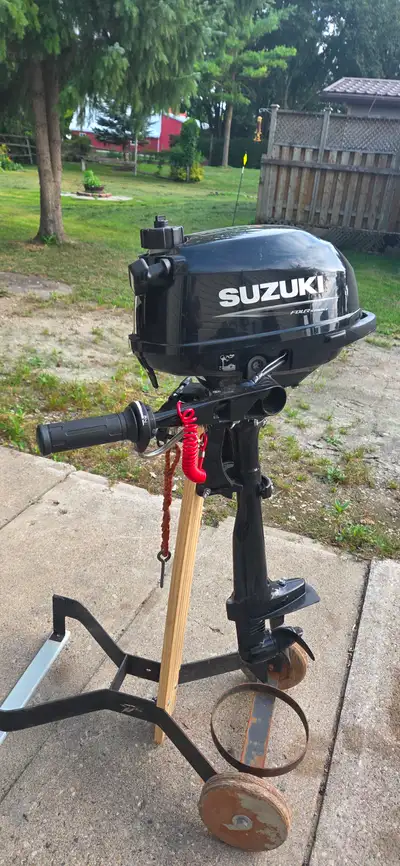 New Great to power small watercraft, aluminum fishing boats, and dinghies. Comes with home made stan...