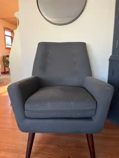 Tufted Midcentury Modern style chair. Solid with wooden legs, View more
