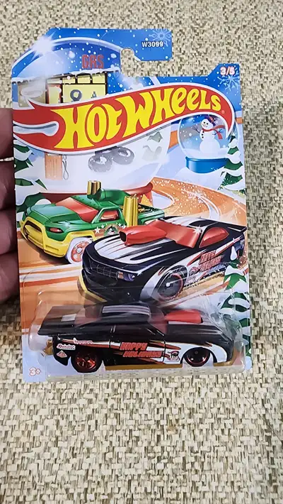 Capture the thrill of the race with the 2024 Hot Wheels "'10 Pro Stock Camaro," a sleek addition to...