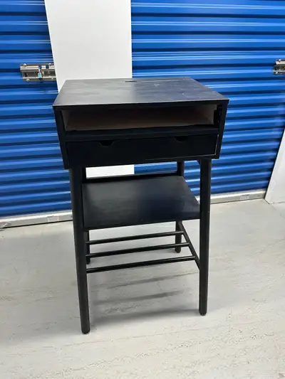 Originally birch finished, painted black. Two drawers, two shelves, metal hooks on either side, top...