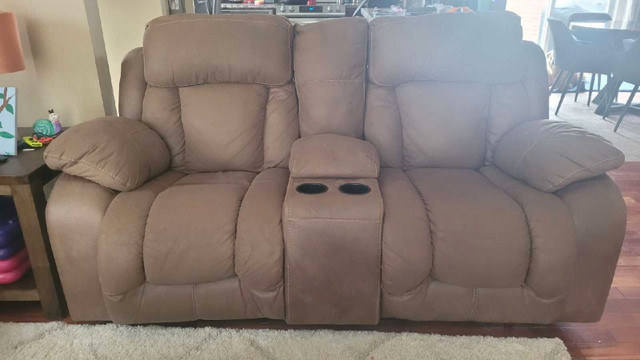 Manual reclining sofa and power reclining loveseat. in Couches & Futons in Cape Breton