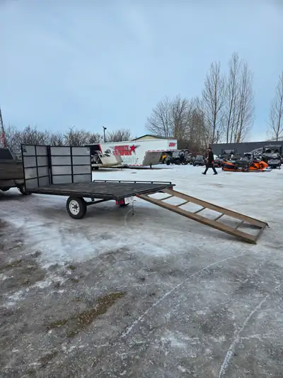 Flat Deck Snowmachine/Utility Trailer Includes Front and Rear Loading Ramps And Spare Tire Also sell...