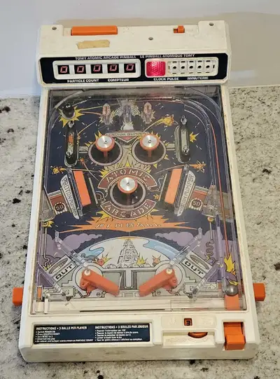 Relive the nostalgia with this vintage 1979 Tomy Atomic Arcade Pinball machine, a classic tabletop g...