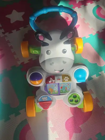 The Fisher-Price Learn with Me Zebra Walker is a delightful and engaging toy designed to support you...