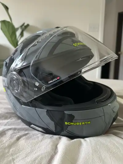 Brand new, never worn Schuberth helmet. Size Small 55 Comes with helmet bag Flip down internal sun v...