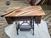 Restored sewing machine base with walnut and epoxy top