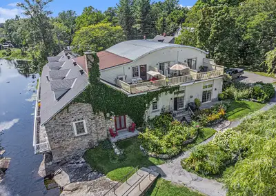 Exceptional. Immaculate. Unique. Two story townhouse with ELEVATOR. On the Little Tay River. In beau...