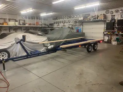 Holds up to 22' boat, new tires and light and paint. Bunk brackets are temporarily clamped in place...