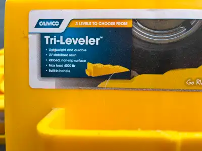 New never used Camco Tri-leveler and a pack of 4 blocks $60 obo