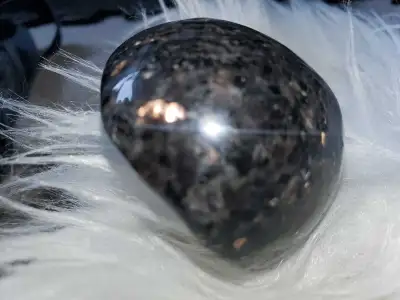 Nuummite Polished hand stone, View more