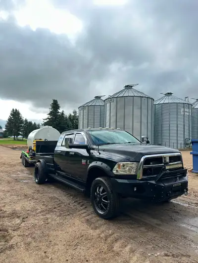 3500 Dodge Dually: Disel engine, Steel flat welders deck with 5th wheel hitch. Sprayer trailer built...