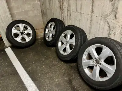 Mercedes ML350 rims. Plus Toyo Open Road tires. 255/55/19 with about 5mm of tread. Basically you are...