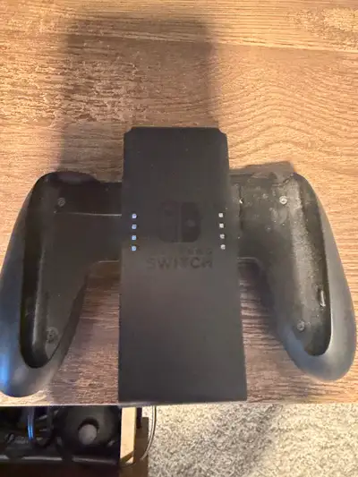 Nintendo switch with dock, extra controllers., View more