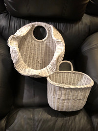 Two white wicker hanging baskets