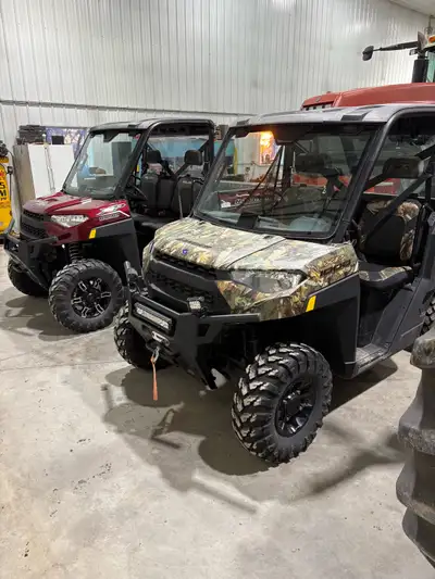 For sale 2 Polaris Ranger 1000 XP side by sides for sale. #1 (Red) is a 2021 with 4750 miles, front...