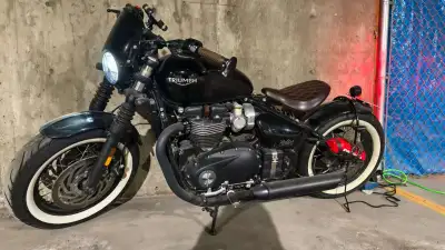 For sale: A **pristine 2018 Triumph Bobber** in all-black, meticulously stored in a **climate-contro...
