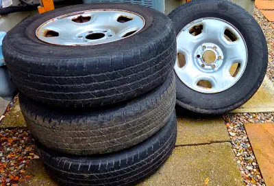 Complete set of 4 original 17-inch Ford F-150 light grey steel rims with tires. These wheels came of...