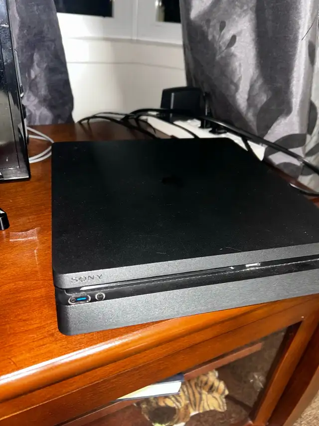 Sony playstation 4 , with a charger62864362175363124