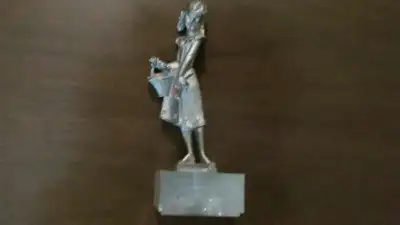 Pewter young girl w/flowers -good cond., View more