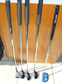 Left handed hybrids, putter, Cleveland sand wedge.