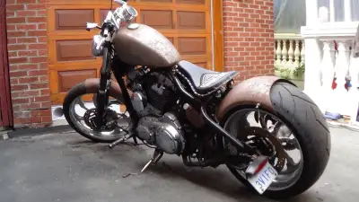 2007 sportster hard tail 15,000km, 250mm rear tire, 18 inch rims runs and drives but accelerator gri...