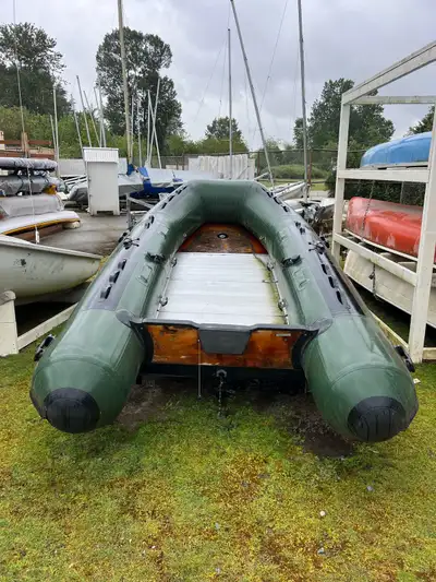 Selling inflatable dinghy. Suitable for approximately 5 adults. Soft bottom. Previously patched. Tra...