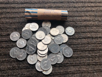 Roll of 2001 “no p” nickels. Coins