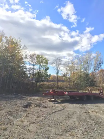 20 ton air brakes 9.5ft wide 20 ft deck 5 ft beaver tail spring assisted ramps 2spare tires on rims