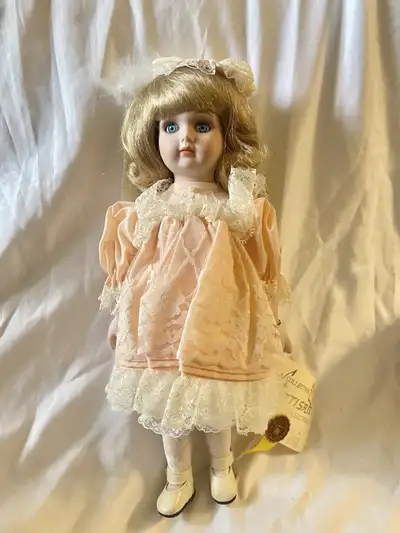 This vintage Artisan porcelain collector's doll is a beautiful addition to any collection. The doll,...