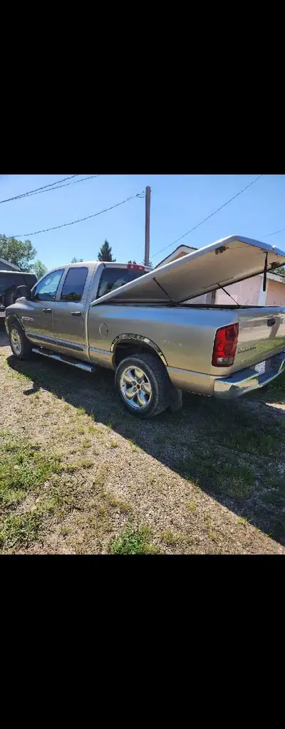 I'm selling my 2002 Dodge Ram 1500 4X4, only 120,000 km. Has 4 doors with matching tunnel cover. Run...
