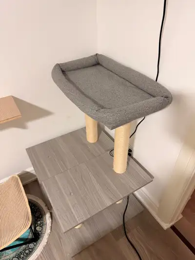 Large cat tree. The top is washable. We have always put a waterproof pad on top of it to keep it new...