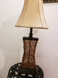 Brown wooden base with beige lampshade table lamp