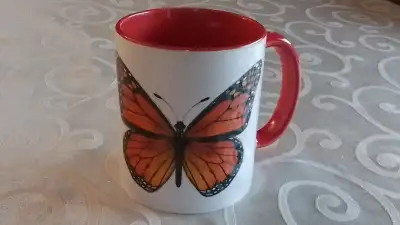 NEW WHITE AND RED PORCELAIN MUG WITH LARGE MONARCH BUTTERFLY PATTERN. IN VERY GOOD CONDITION, LIKE N...