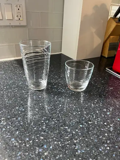 8 small and 7 large drinking glasses never used.