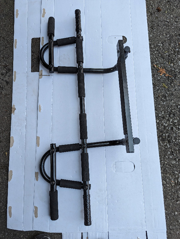 Never used doorway Pull Up Bar, Portable Chin Up Bar, Multifunct in Exercise Equipment in Markham / York Region