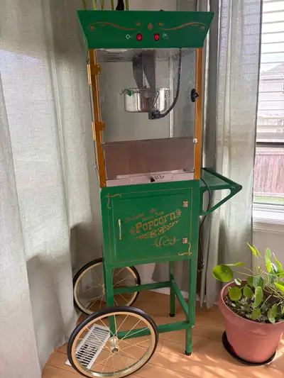 Get ready to bring the cinematic experience right into your home with this charming, used popcorn ma...