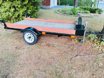 Sturdy tilt bed utility trailer. Includes mounted spare tire, leveling jack with caster for easy mov...
