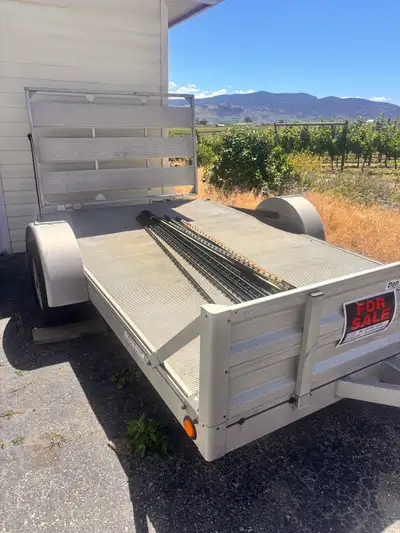 2012 aluminum trailer 10 feet long 6 feet wide of trailer space and a total of 14ft with hitch. This...