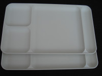 2 white Tupperware trays