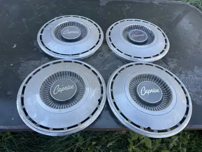 Set of 14 hubcaps from a 1968 Chevrolet Caprice