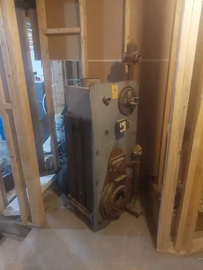 Cast hot water heater/boiler (no burner), as is, asking $100. Very heavy. Buyer must remove from bas...