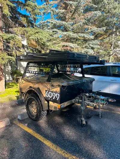 Custom built off road capable trailer with top of the line roof top tent. Only selling because I don...
