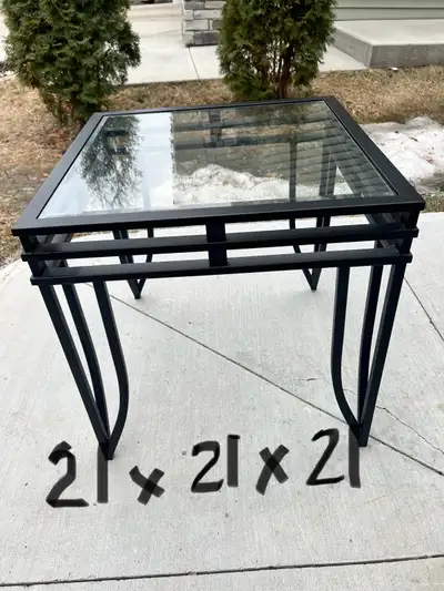 Very good condition black metal glass end table perfect for any home. Pick up an SW Edmonton area.