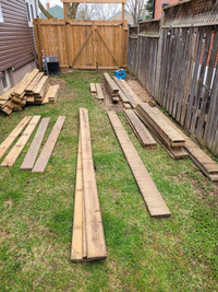 Used deck boards, 2x6s and 2x8s.