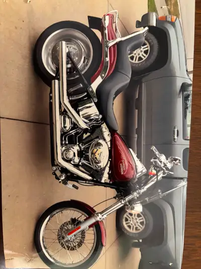 2009 FXSTC 38,000klm red, lots of chrome, loud, crash bar, saddlebags and supports Inc. $11,000 obo....